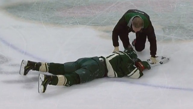 Parise takes high stick, nasty collision on same play