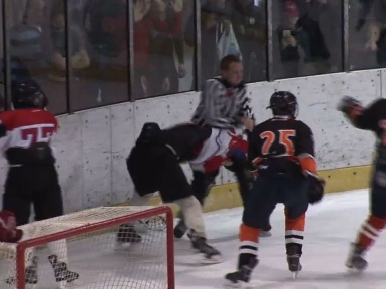 Watch Ref, player exchange punches during youth hockey brawl