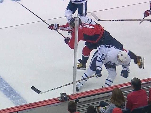 Watch: Ovechkin forced from game momentarily after Kadri hip check