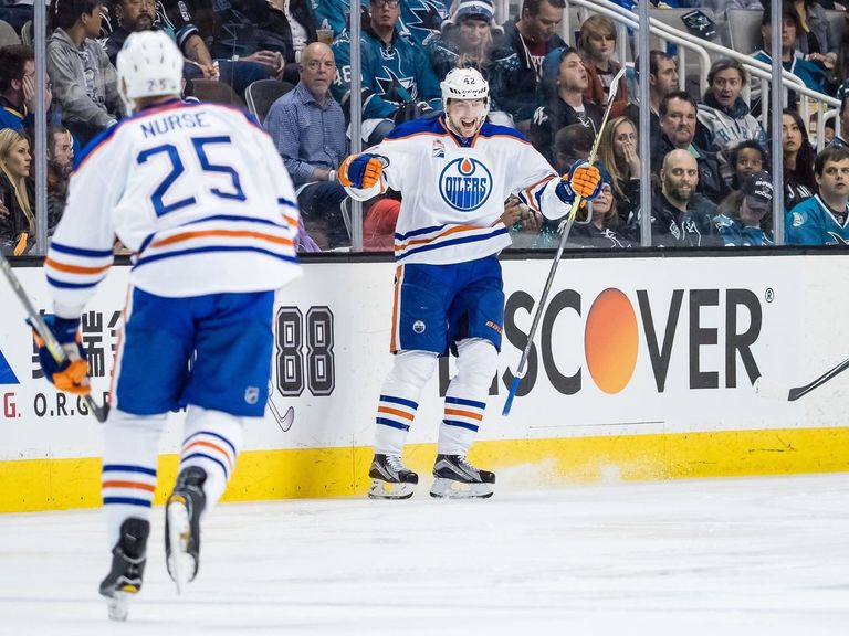 Oilers hang on to beat Sharks for 1st series win since 2006
