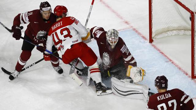 Watch: Latvia goalie celebrates shutout by tackling teammate