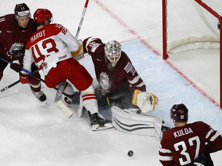 Watch Latvia goalie celebrates shutout by tackling teammate