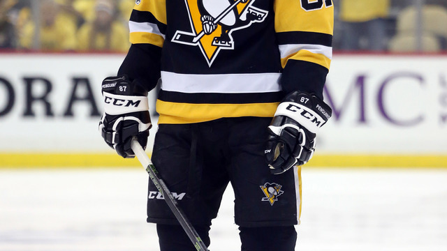 Crosby avoids injury after falling headfirst into end boards