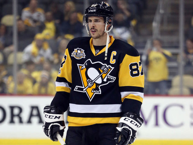 Crosby avoids injury after falling headfirst into end boards