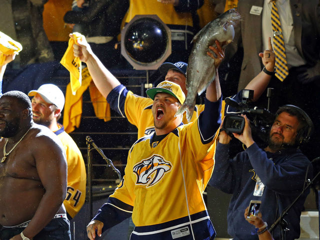 Watch: Titans' Lewan chucks catfish on ice during Predators' Game 6 win