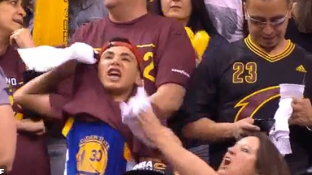 Watch: Fan reveals Warriors jersey under Cavs shirt