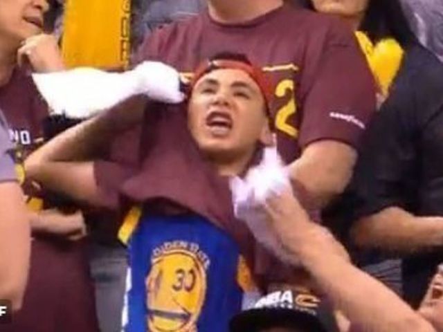 Watch: Fan reveals Warriors jersey under Cavs shirt