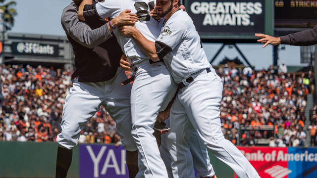 Watch: Giants' Strickland forcefully restrained after drilling Harper