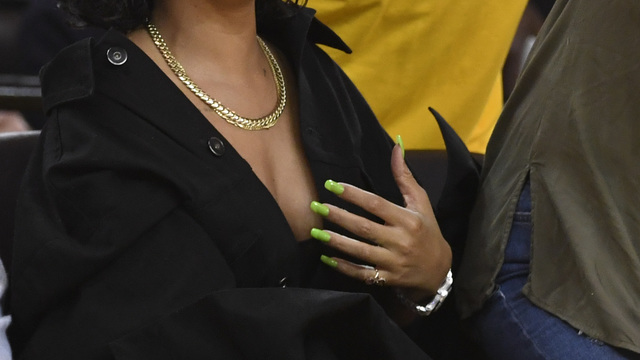 Watch: Rihanna bows to LeBron, dabs on Warriors fan