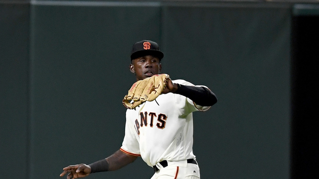 Watch: Giants' Calixte overthrows everything, ball gets stuck in backstop