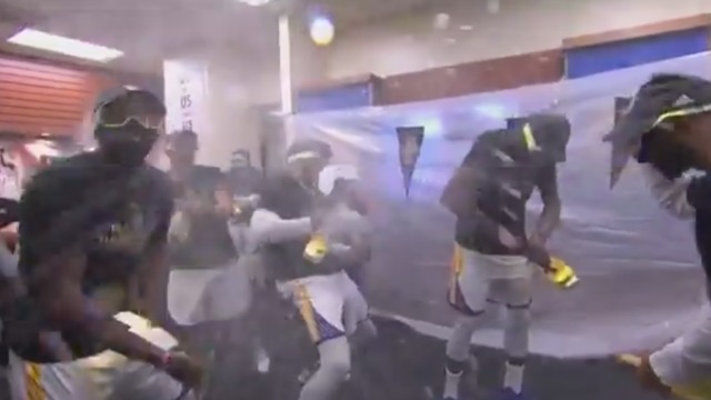 Watch: Champagne flows in Warriors' locker room after title win