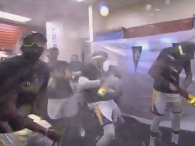 Watch: Champagne flows in Warriors' locker room after title win