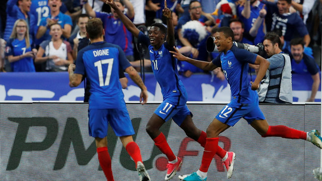 Dembele leads 10-man France past England in frantic friendly