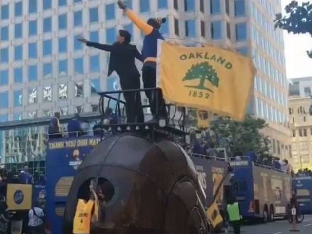 Watch: MC Hammer, Oakland mayor ride motorized snail at Warriors parade