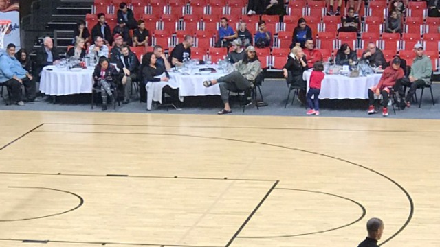 Adams takes in New Zealand league game from courtside dinner table