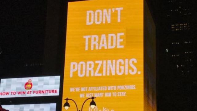 'Don't trade Porzingis' billboard lights up across from MSG on draft night