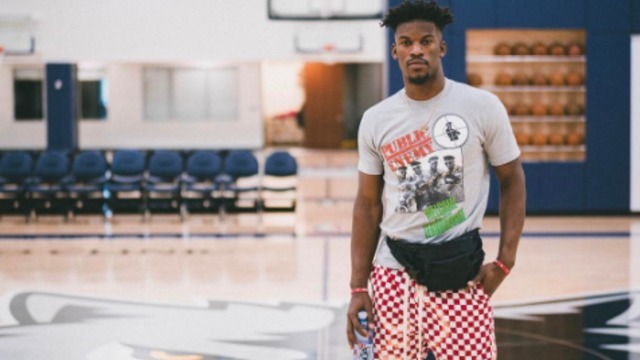 Jimmy Butler poses at 'new home' in Timberwolves' gym