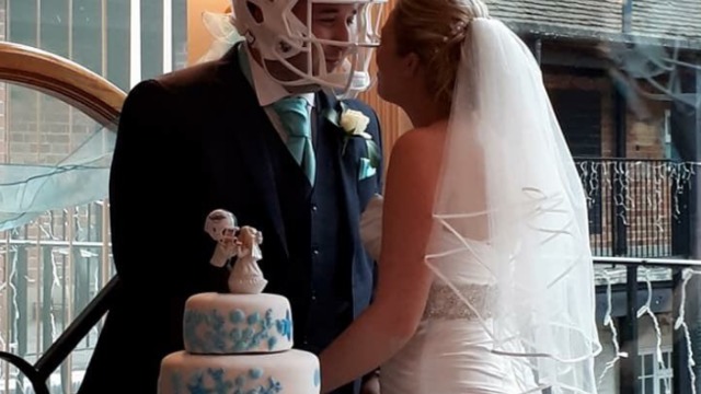 Fan wears Dolphins helmet at wedding