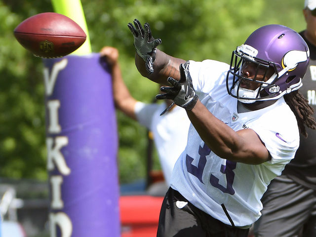 Vikings' Cook plays down notion he's replacing Peterson