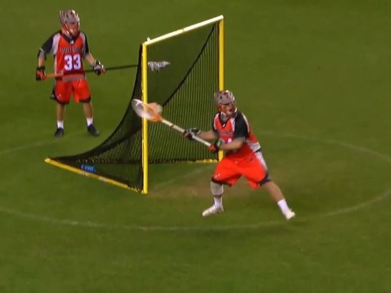 Watch Lacrosse goalie scores fullfield goal while counterpart zones