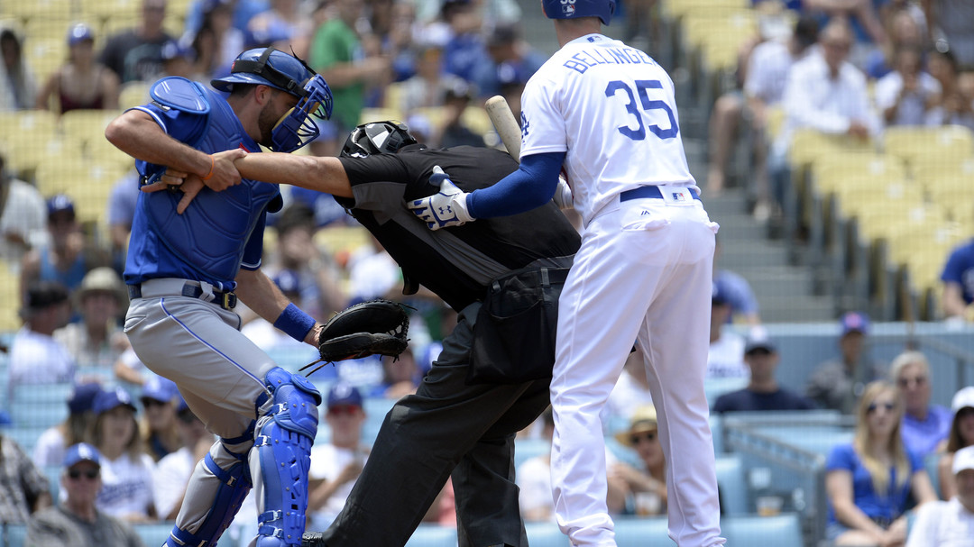 Home plate umpire leaves game after being hit in mask by | theScore