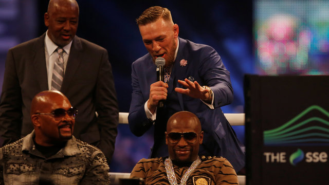 Watch: McGregor rubs Mayweather's 'peanut head,' mimes slap
