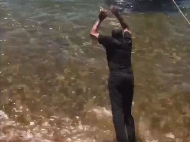 Watch: Dell Curry jumps in lake after losing father-son bet with Steph