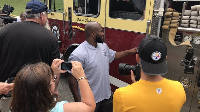 Watch: Steelers' Harrison pulls up to camp in fire truck