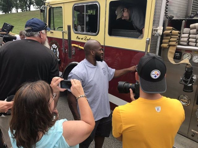 Watch: Steelers' Harrison pulls up to camp in fire truck