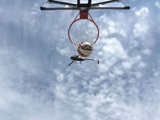 Watch: Harlem Globetrotter hits 210-foot shot from helicopter