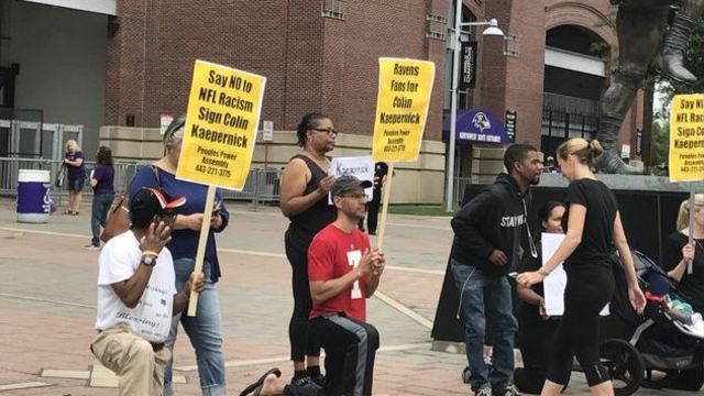Small crowd protests outside stadium for Ravens to sign Kaepernick