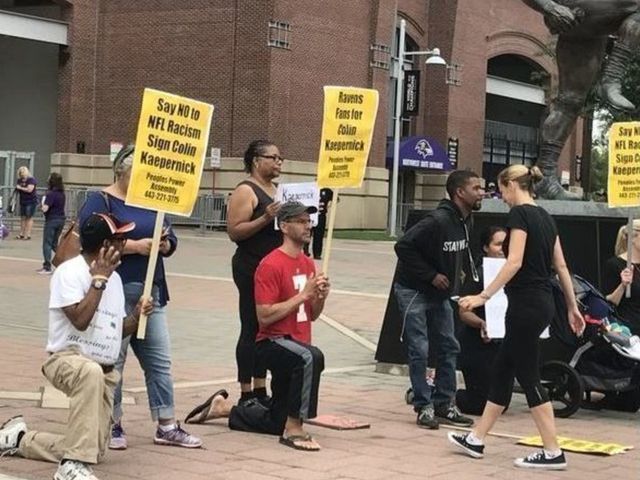 Small crowd protests outside stadium for Ravens to sign Kaepernick