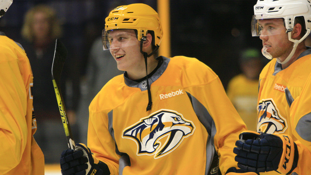 Watch: Preds' pick Tolvanen nets historic hat trick in KHL debut