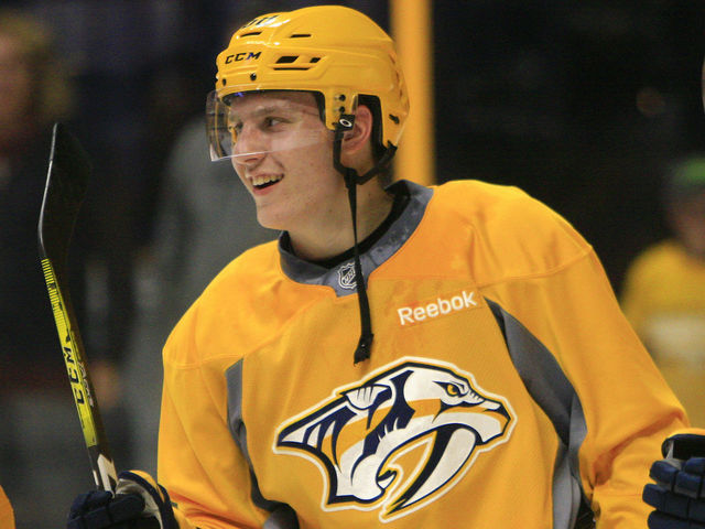 Watch: Preds' pick Tolvanen nets historic hat trick in KHL debut