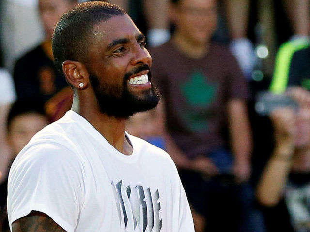 Look: Kyrie poses with 'Uncle Drew' cast