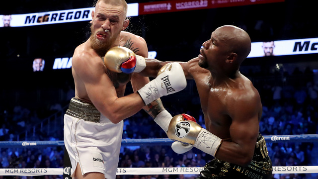 Mayweather scores 10th-round TKO on McGregor after spirited bout