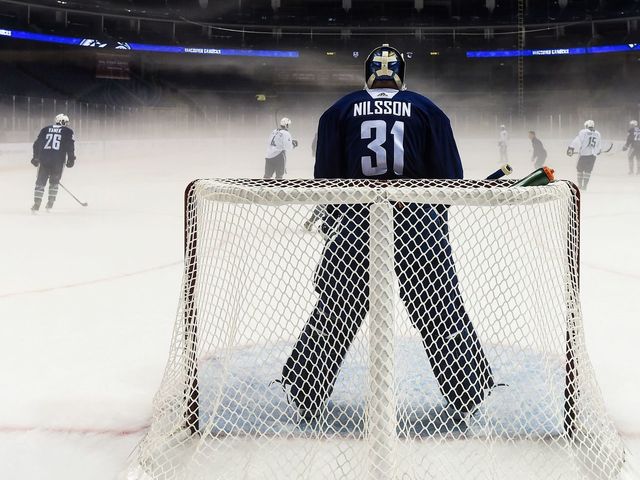 Canucks practice through heavy fog in Shanghai arena