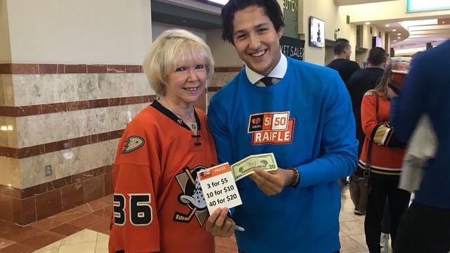 No nights off: Ducks players serve fans around rink before preseason game