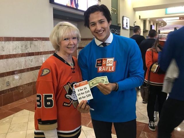 No nights off: Ducks players serve fans around rink before preseason game