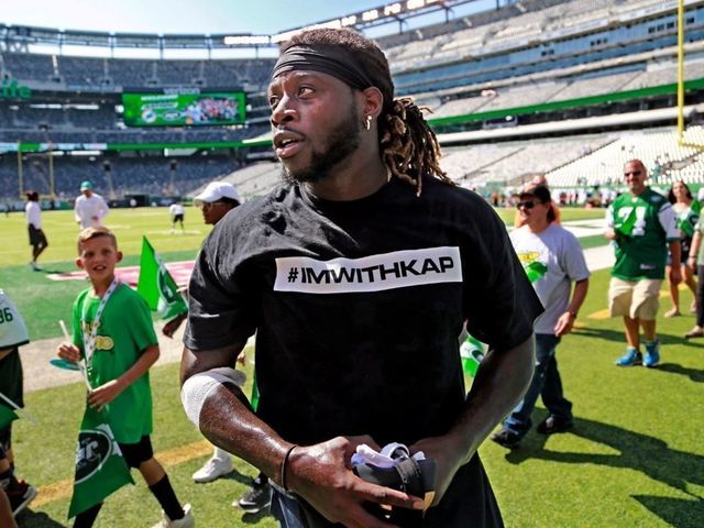 Dolphins players wearing 'I'm With Kap' shirts during pregame