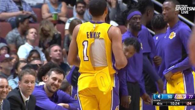 Watch: Lakers' Ennis gives fan jersey midgame after it tears apart