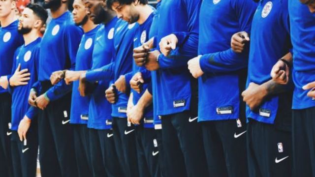 Look: Clippers, Raptors lock arms during U.S. and Canadian anthems