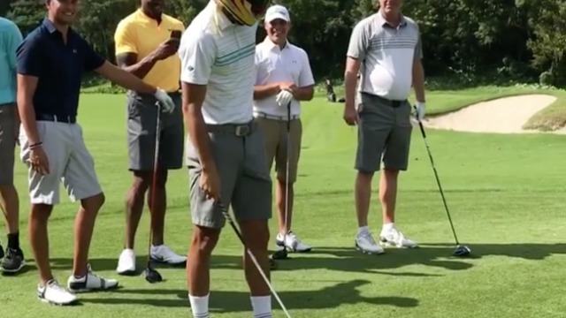 Watch: Curry tries to golf while wearing Lewis Hamilton's helmet
