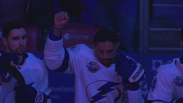 Lightning's Brown stands with raised fist during national anthem