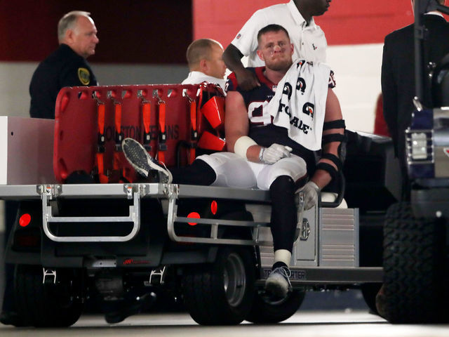 Watch: Watt on crutches as he boards ambulance following knee injury
