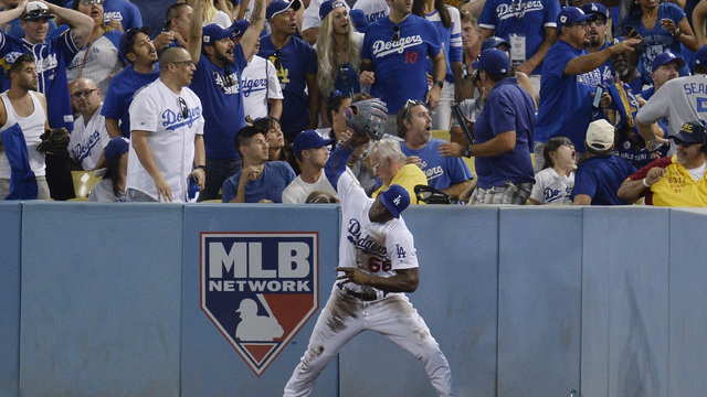 Watch: Puig spikes glove in frustration after missed catch