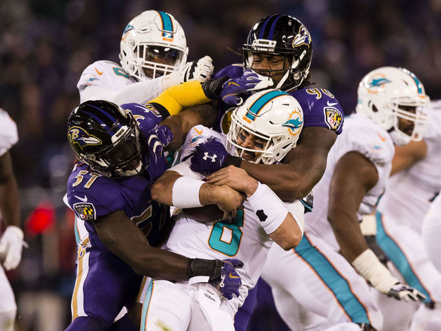 Ravens decimate Dolphins 40-0 in chippy affair after Flacco knocked out