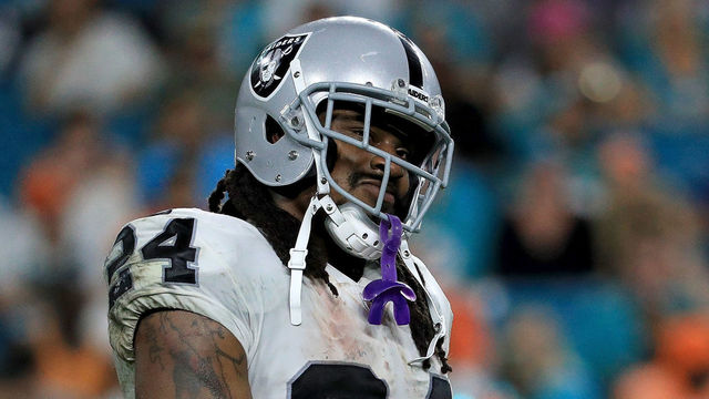 Look: Marshawn Lynch sits during American anthem, stands for Mexican