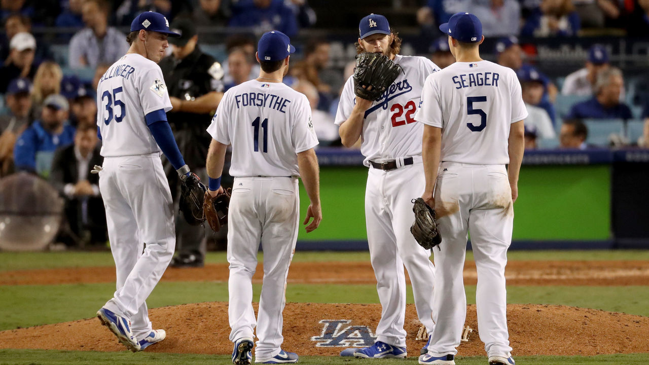 LOS ANGELES, CA - NOVEMBER 01: Clayton Kershaw #22 of the Los Angeles Dodgers meets with teammates on the pitcher's mound during the sixth inning against the Houston Astros in game seven of the 2017 World Series at Dodger Stadium on November 1, 2017 in Los Angeles, California. (Photo by Christian Petersen/Getty Images)