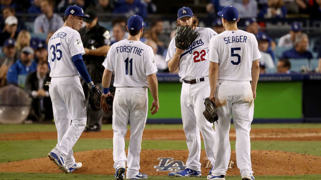 LOS ANGELES, CA - NOVEMBER 01: Clayton Kershaw #22 of the Los Angeles Dodgers meets with teammates on the pitcher's mound during the sixth inning against the Houston Astros in game seven of the 2017 World Series at Dodger Stadium on November 1, 2017 in Los Angeles, California. (Photo by Christian Petersen/Getty Images)